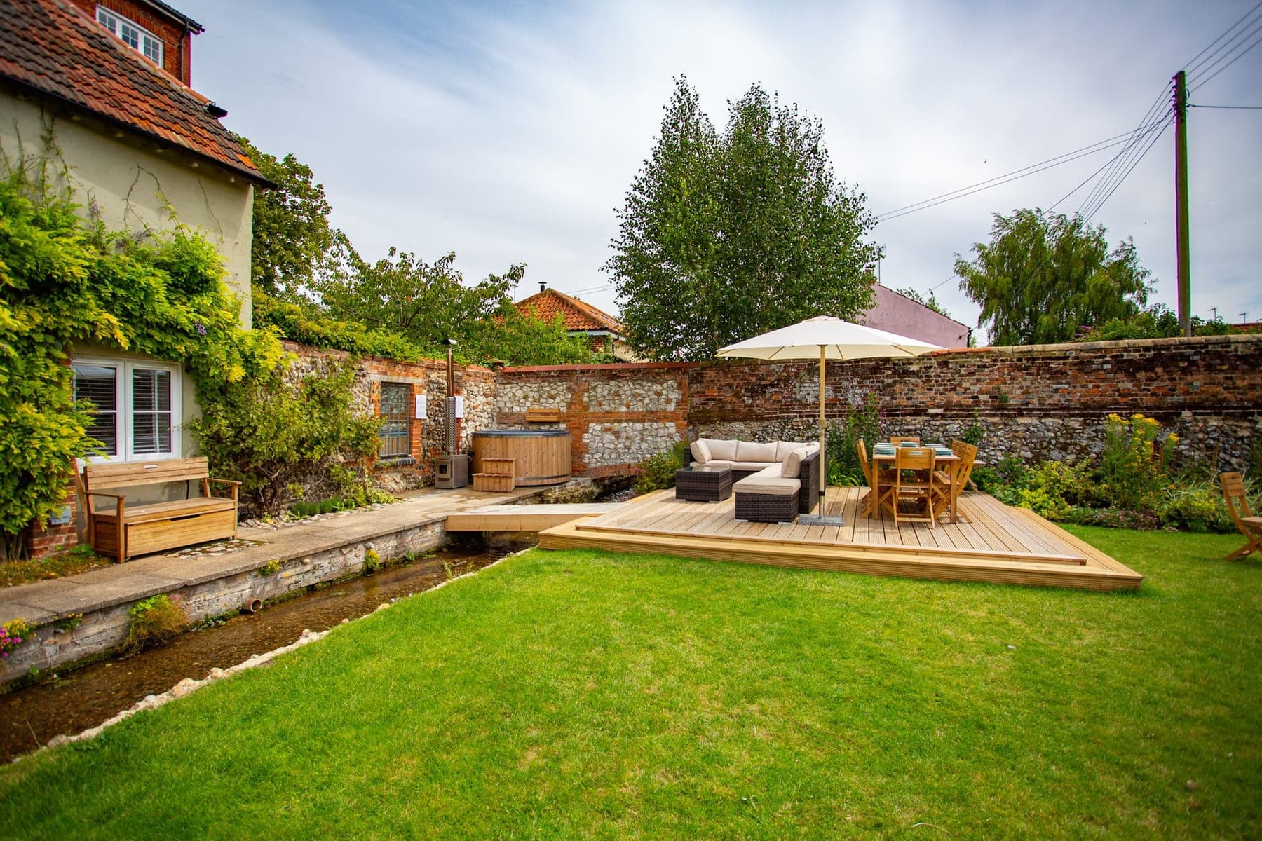 The walled garden with its parasol and seating