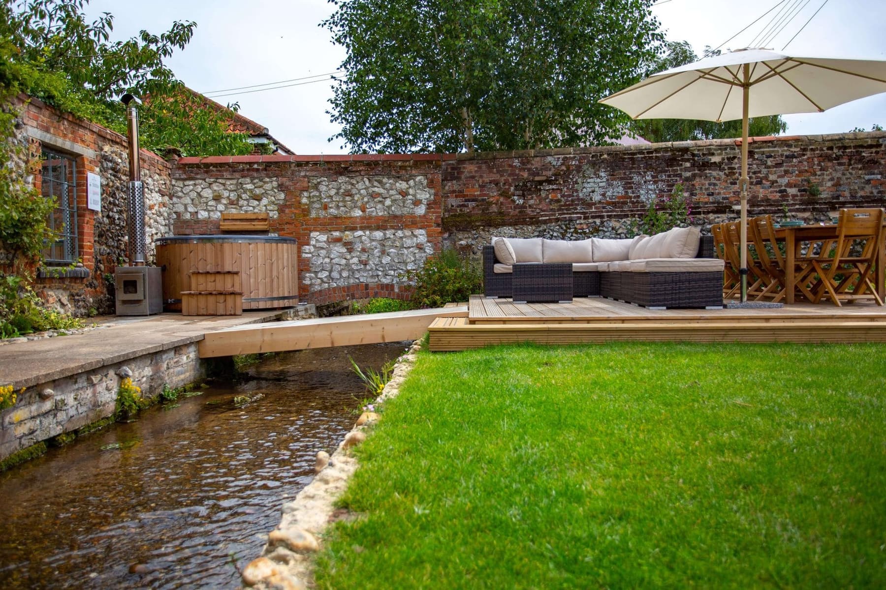 The creek running past the lawn at South Creek Retreat